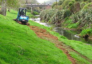 Paul Jarvie with his digger benched the track for Riverbank Terrace Walkway and installed the culverts